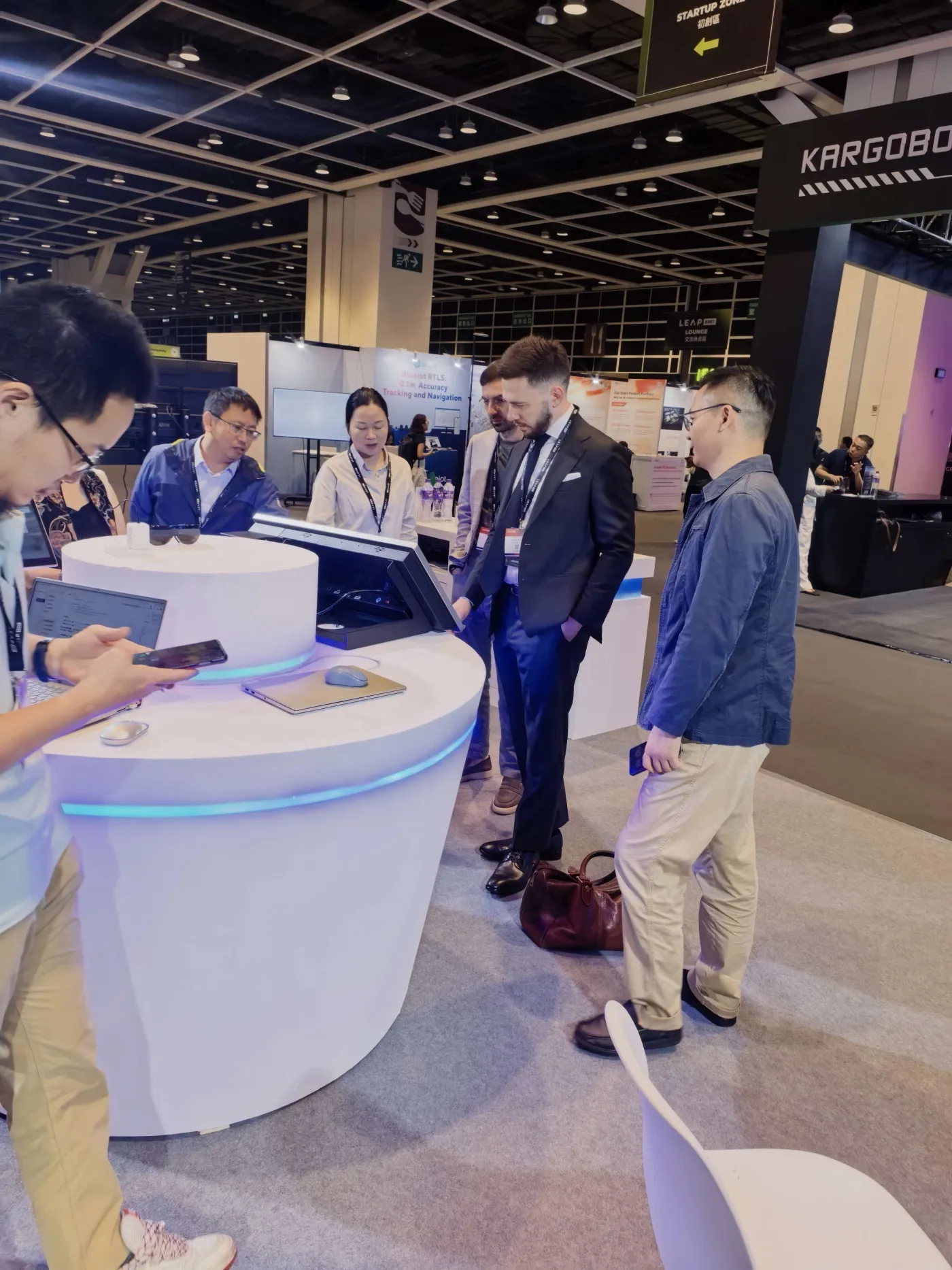 Visitors gathering around a live product demonstration