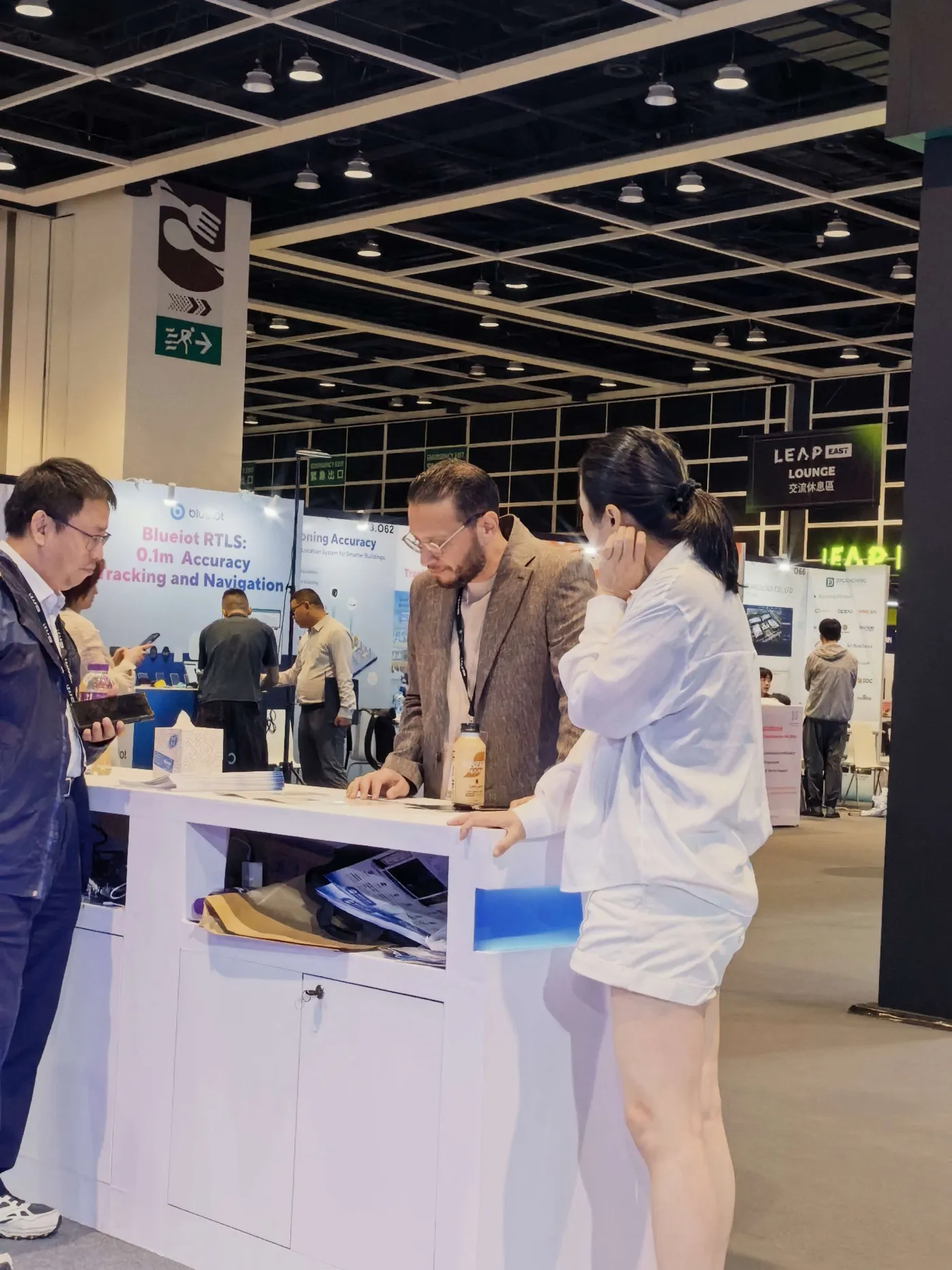 The Toyou Information team speaking with an international visitor